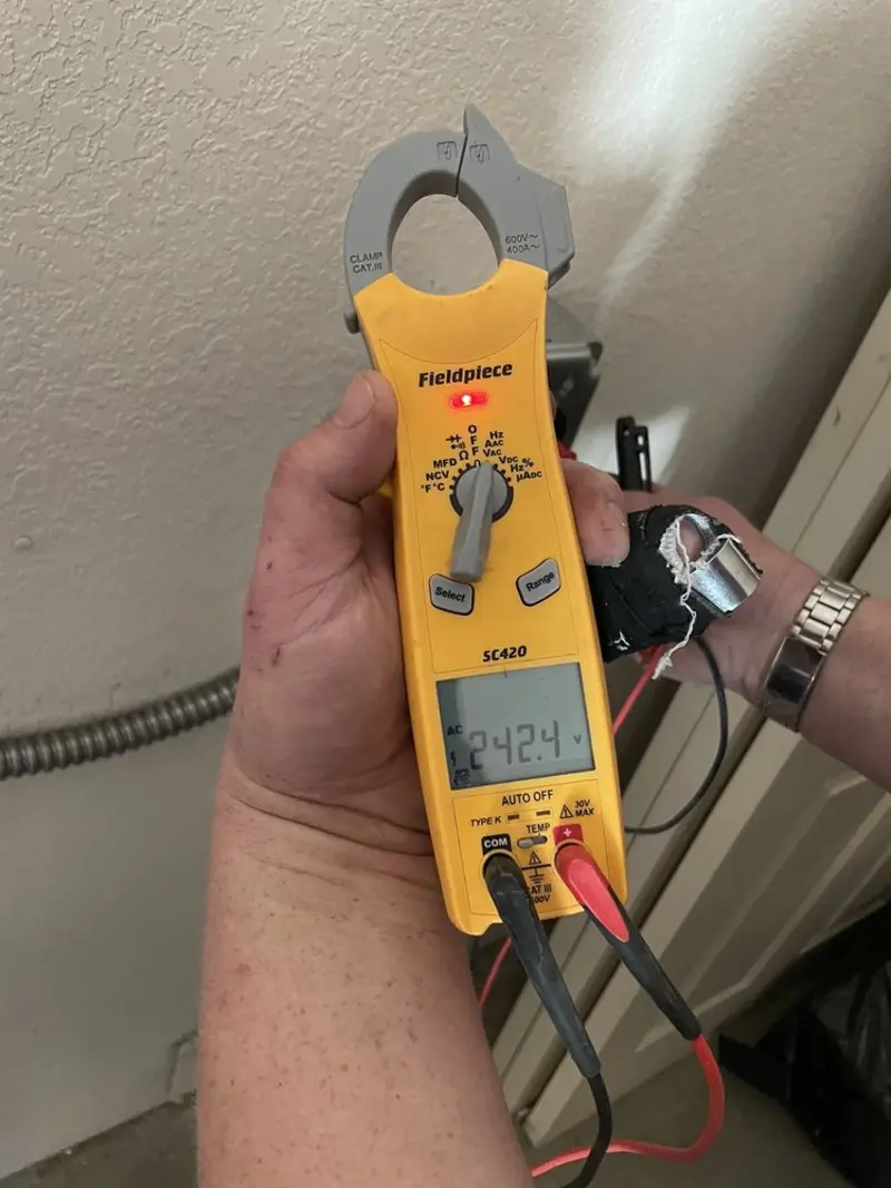 Voltage testing with clamp meter during Circuit Breaker Repair in Conover